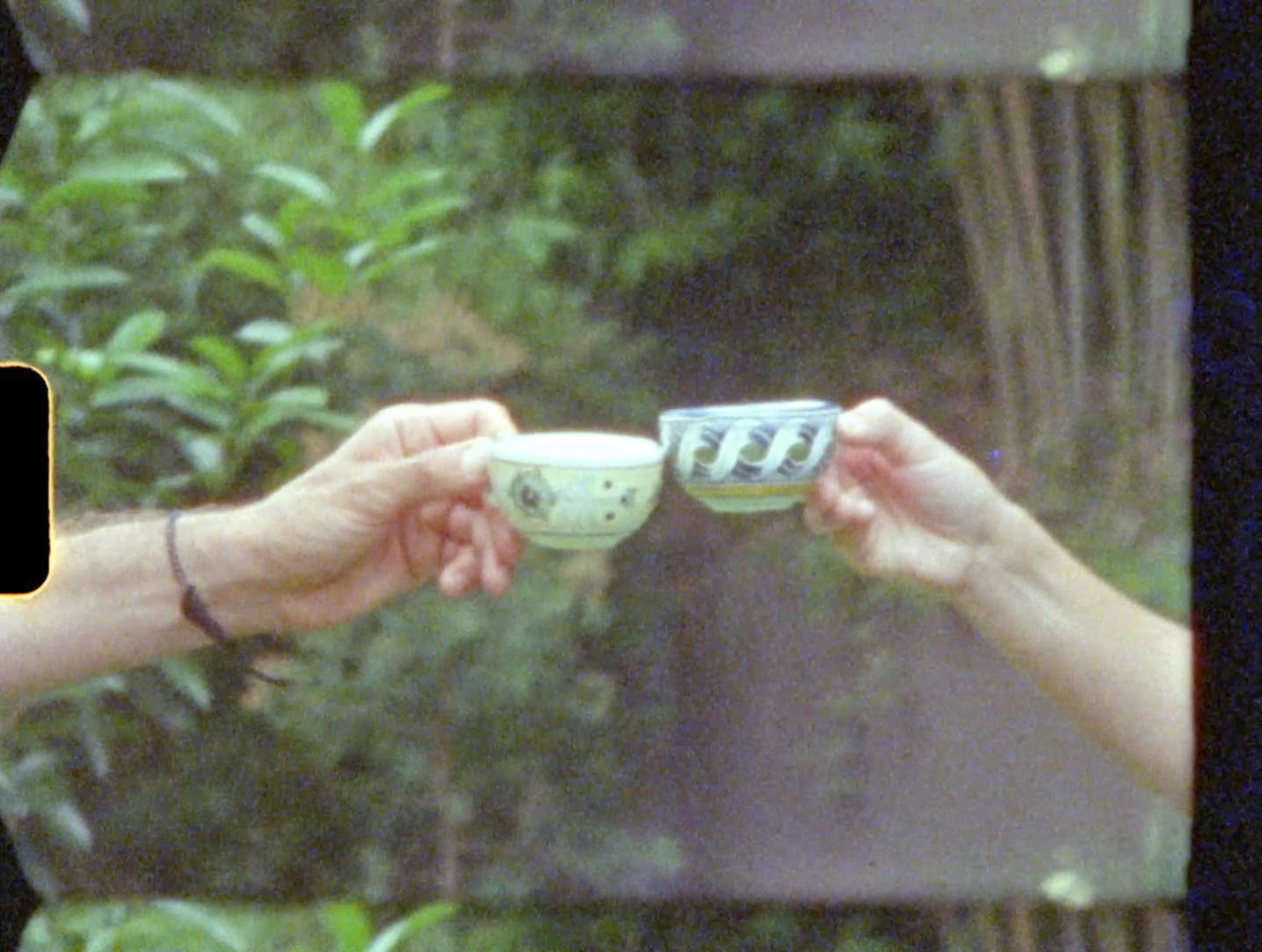 friends clinking their coffee cups